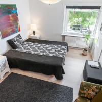 a small living room with two beds and a couch at BB Ikast