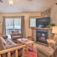 a living room with a fireplace and a tv at Biwabik Vacation Rental Near Giants Ridge!