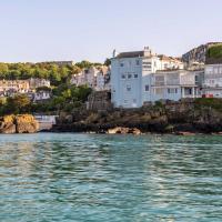 a view of a city from the water with houses at Pedn-Olva, St Ives