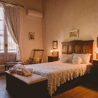 a bedroom with a large bed and a window at Casa de Aitona Bodega Zubizarreta, Carmelo