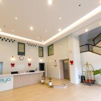 an office lobby with a reception desk and a staircase at Seeya Hotel, Tubigon