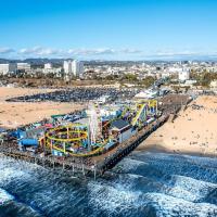 an aerial view of a beach with a roller coaster at Cozy Apartment at Santa Monica, Los Angeles