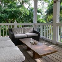 a porch with a couch and a coffee table at Stunning Loft 2 Floor Unit with Balcony, Contadora