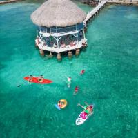 an aerial view of people in the water at a resort at Quinta del Mar Tintipán, Isla Mucura