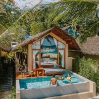 two people playing in a swimming pool in front of a house at Irene Pool Villa Resort, Koh Lipe, Ko Lipe