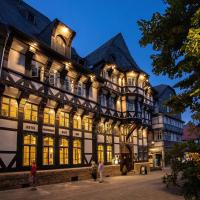 a large building with people standing in front of it at Romantik Hotel Alte Münze, Goslar