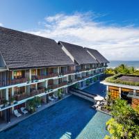 an aerial view of the resort with the ocean in the background at Swarga Suites Bali Berawa, Canggu