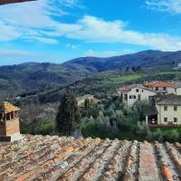 a view of a village from a roof at Villino Chianti, Cavriglia
