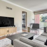 a living room with a couch and a tv at Los Gatos 2BR w WD Pool 10 mins to Netflix SFO-757