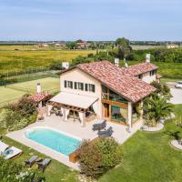 an aerial view of a house with a swimming pool at Stunning home in Jesolo with Outdoor swimming pool, WiFi and 6 Bedrooms