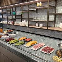 a buffet with different types of food on a counter at Hotel Atlanta Knokke, Knokke-Heist