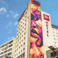a building with a large painting on the side of it at ibis Lima Larco Miraflores