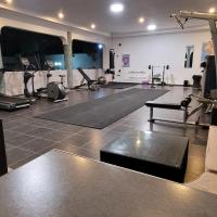 a room with a gym with pilates equipment at toughen up, Bagamoyo