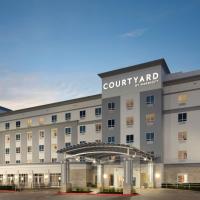 a rendering of a court yard hotel at Courtyard by Marriott Houston Kemah