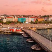 a bridge over the water next to a city at Brion City Hotel BW Signature Collection, Willemstad