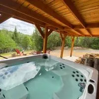 Chalet bois rond aux paysages uniques avec Spa !, отель в городе Lac-aux-Sables