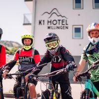 a group of people on bikes in front of a building at K1 Hotel Willingen