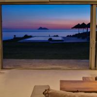 Beachfront villa Komos with heated pool