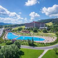 an aerial view of a resort with a large swimming pool at Bachleda Hotel Kasprowy, Zakopane