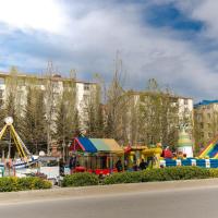 a playground in a park with slides and rides at HappyHome, Masazır