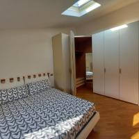a bedroom with a bed and a white closet at appartamento via provenzali, Cento