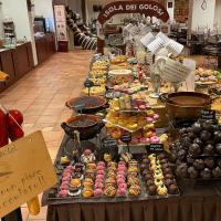 a buffet of different types of pastries on a table at Chocohotel, Perugia