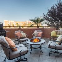 a patio with chairs and a table and a fire pit at SpringHill Suites Ridgecrest