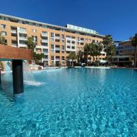 a large pool of water in front of a building at Hotel Neptuno by ON GROUP, Roquetas de Mar