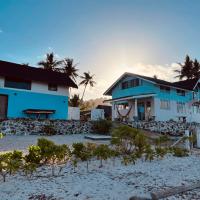 a blue and white house on the beach at BlueWave Surf Stay, San Isidro