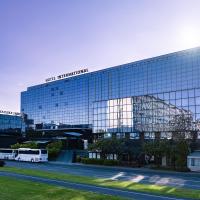 a bus is parked in front of a building at Maistra City Vibes Hotel International, Zagreb