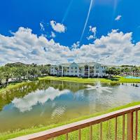 a view of a house from a balcony with a pond at Four Mile Cove Enlightenment, Cape Coral