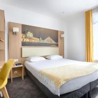 a hotel room with a large bed and a desk at Hotel De Paris, Boulogne-Billancourt