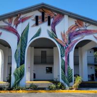 a building with a mural on it at Vivo Flex Living Kissimmee