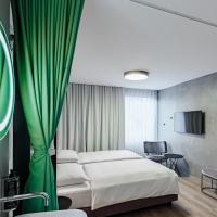 a hotel room with a bed and a mirror at ibis Styles Ljubljana Centre