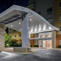a building with a large white canopy over a parking lot at Fairfield Inn & Suites by Marriott Atlanta Stonecrest, Lithonia