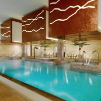 a large swimming pool in a hotel lobby at Sheraton Athlone Hotel