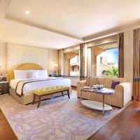 a bedroom with a bed and a living room at ITC Maratha, a Luxury Collection Hotel, Mumbai