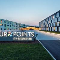 a sign that reads four points by strength on a building at Four Points by Sheraton Ljubljana Mons