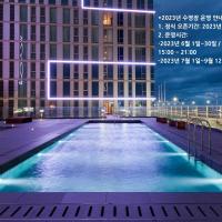 a swimming pool in front of a building at night at Hotel Regent Marine The Blue, Jeju