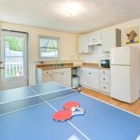a kitchen with a ping pong table in the middle at Family-Friendly Vacation Rental with Game Room!, Malden