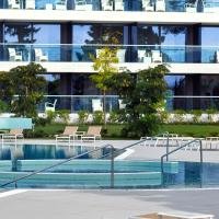 a swimming pool in front of a building at Sheraton Dubrovnik Riviera Hotel, Mlini