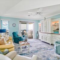 a living room with blue walls and yellow furniture at Wrightsville Dunes 3D, Wrightsville Beach