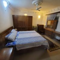 a bedroom with a bed and a television in it at Bock house, Djibouti