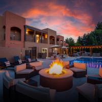 a patio with a fire pit in front of a building at Arroyo Pinion Hotel, Ascend Hotel Collection, Sedona