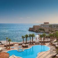 an aerial view of a resort with a swimming pool and the ocean at The Westin Dragonara Resort, Malta, St Julian's