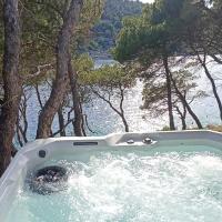 Apartment by the sea Žirje with private heated hydromassage pool