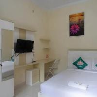 Teratai Guesthouse Mitra RedDoorz near Tugu Yogyakarta, hotel em Sinduadi, Kejayan