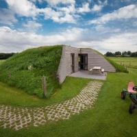 Ecological bungalow with decorative fireplace, located on a holiday farm