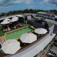an overhead view of a hotel with umbrellas at Cheeky Monkey's Samui, Chaweng