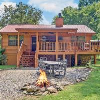 Riverfront Cabin with Hot Tub and Mountain Views!